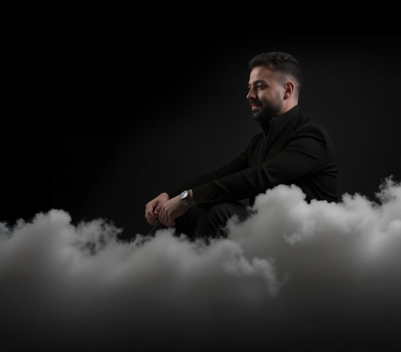 Charles Nasr seated above the clouds